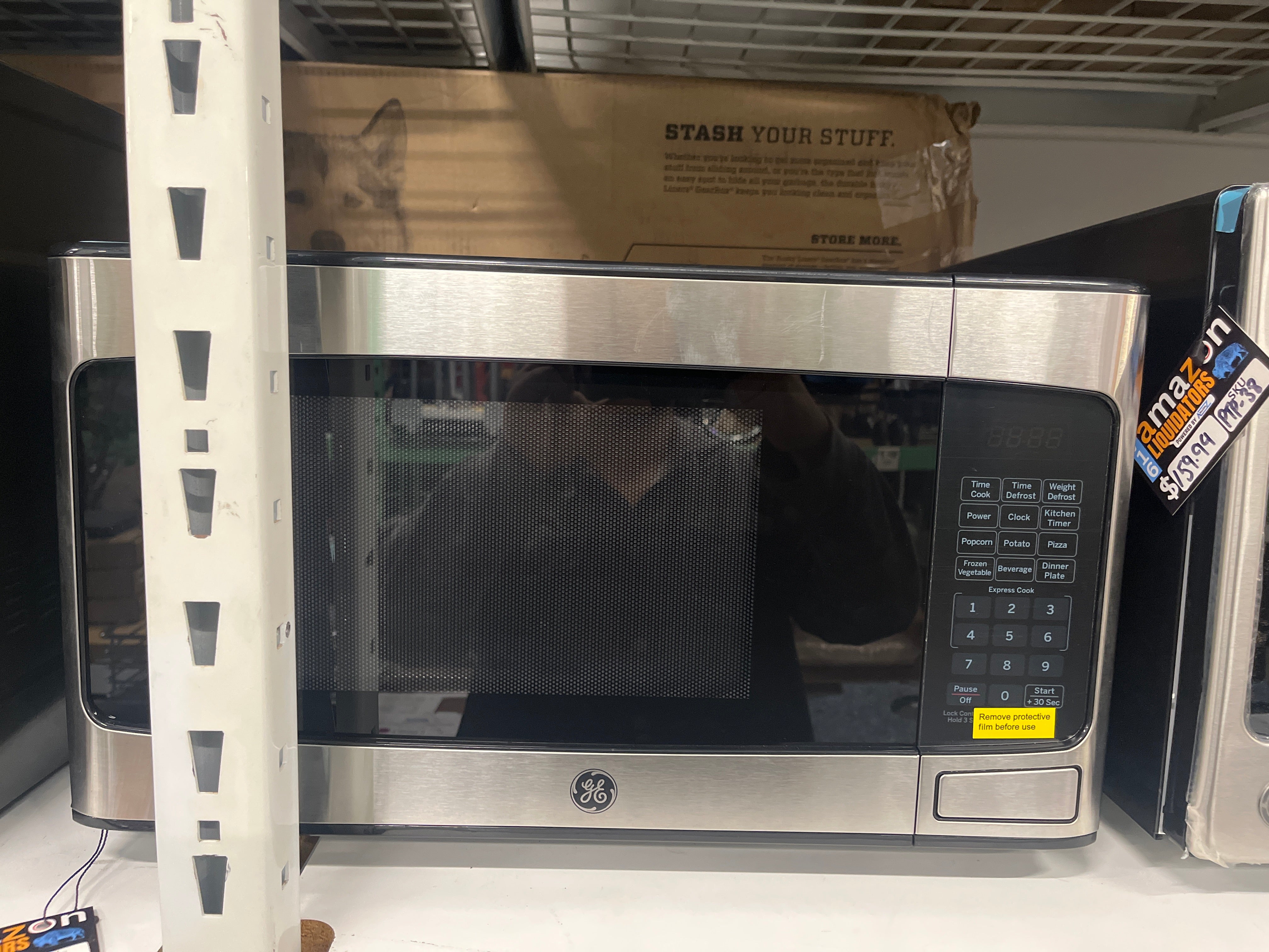 GE - 1.1 Cu. Ft. Mid-Size Microwave - Stainless steel - display_model