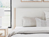Signature Design Two-tone King Upholstered Panel Bed