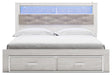 Signature Design White King Upholstered Bookcase Bed with Storage