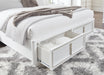 Signature Design White California King Upholstered Storage Bed