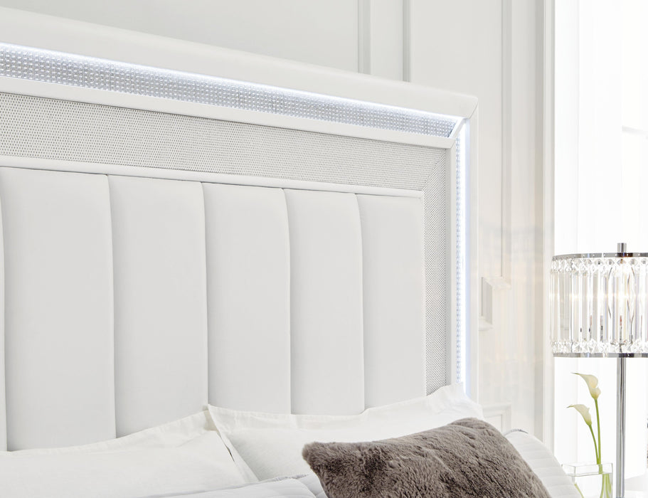 Signature Design White California King Upholstered Storage Bed