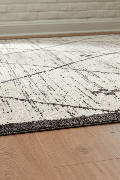 Signature Design Medium Rug 5.27 FT by 7.06 FT