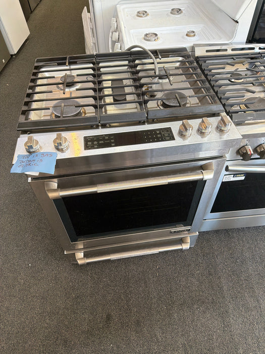 JennAir  30 Inch Slide-In Dual Fuel Range with 4 Sealed Burners, 6.2 cu. ft. Oven Capacity, Continuous Grates, Self-Clean Mode, Downdraft Ventilation, and True Convection: Stainless Steel - used_good